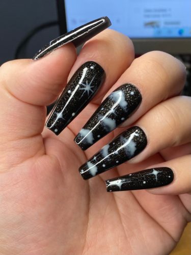 Black "starry haze" night sky nails with glitter